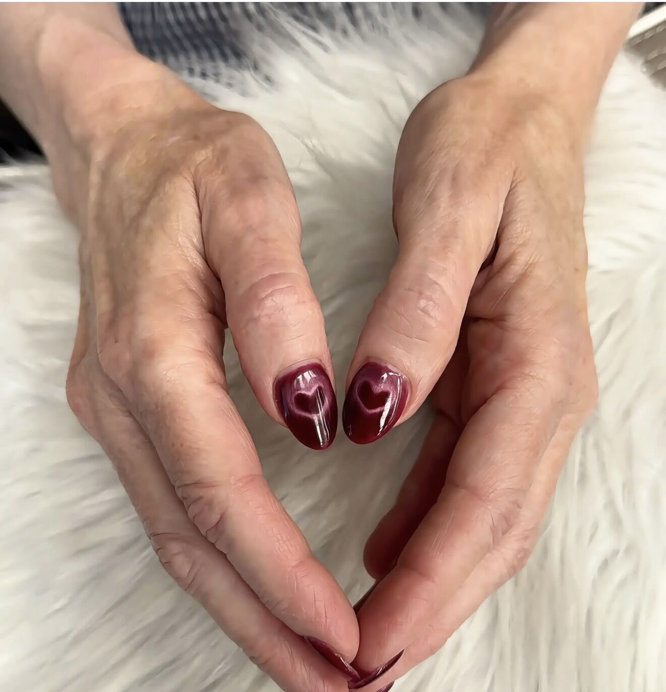 Burgundy gel manicure with delicate heart nail art on short natural nails, Lone Tree CO