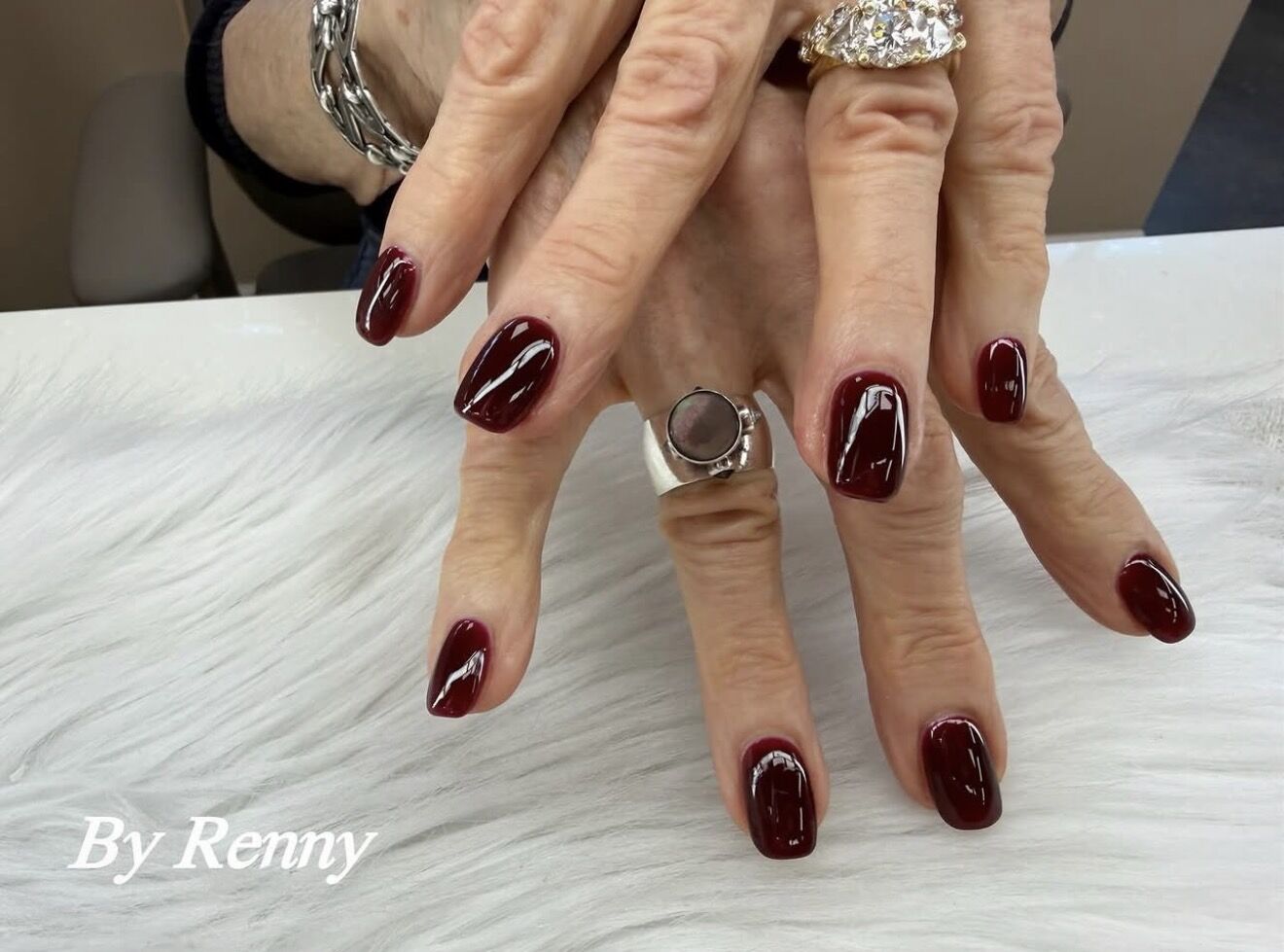 Classic glossy burgundy gel manicure on natural nails by Renny, Lone Tree Colorado