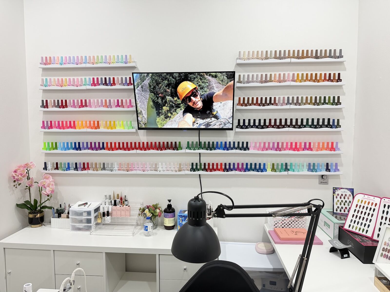 Wall of gel polish colors above the manicure station at Ni Hao Nail Studio, Lone Tree CO