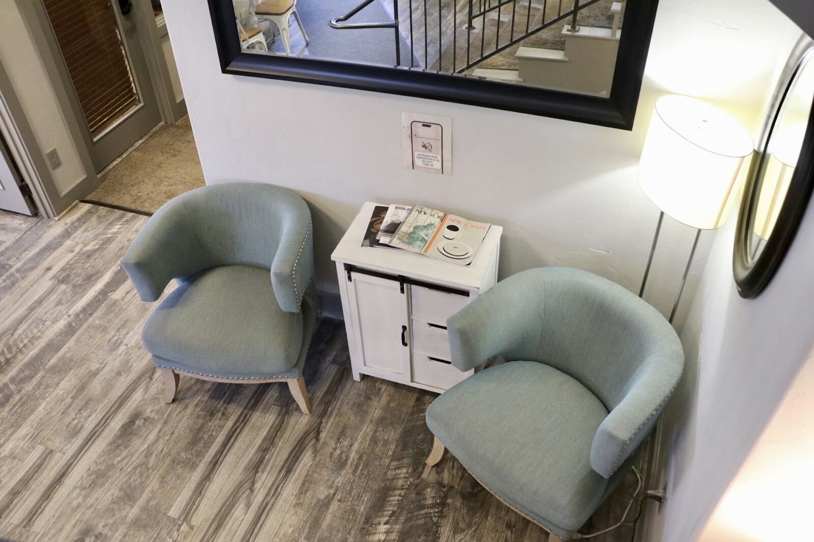 Quiet waiting lounge chairs outside the nail studio suite at 9049 Forsstrom Dr, Lone Tree
