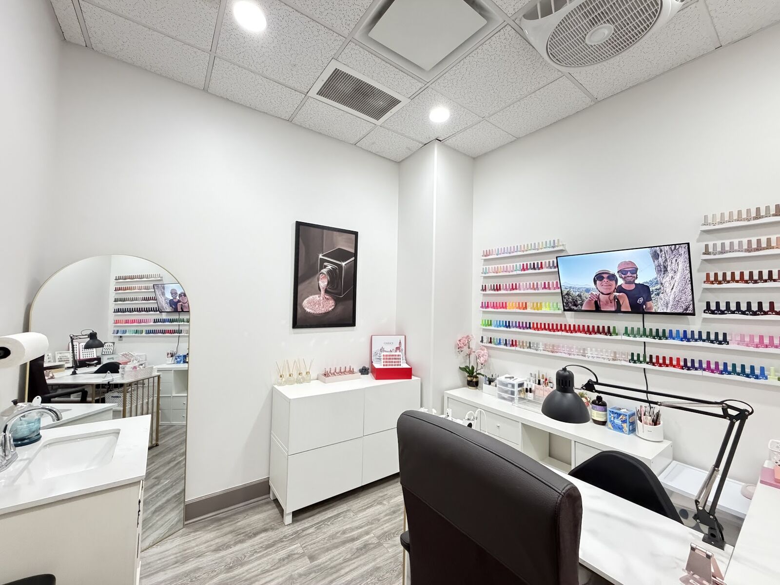 Inside Ni Hao Nail Studio — Lone Tree, CO Private nail suite interior at Ni Hao Nail Studio in Lone Tree, Colorado with manicure desk and gel color wall