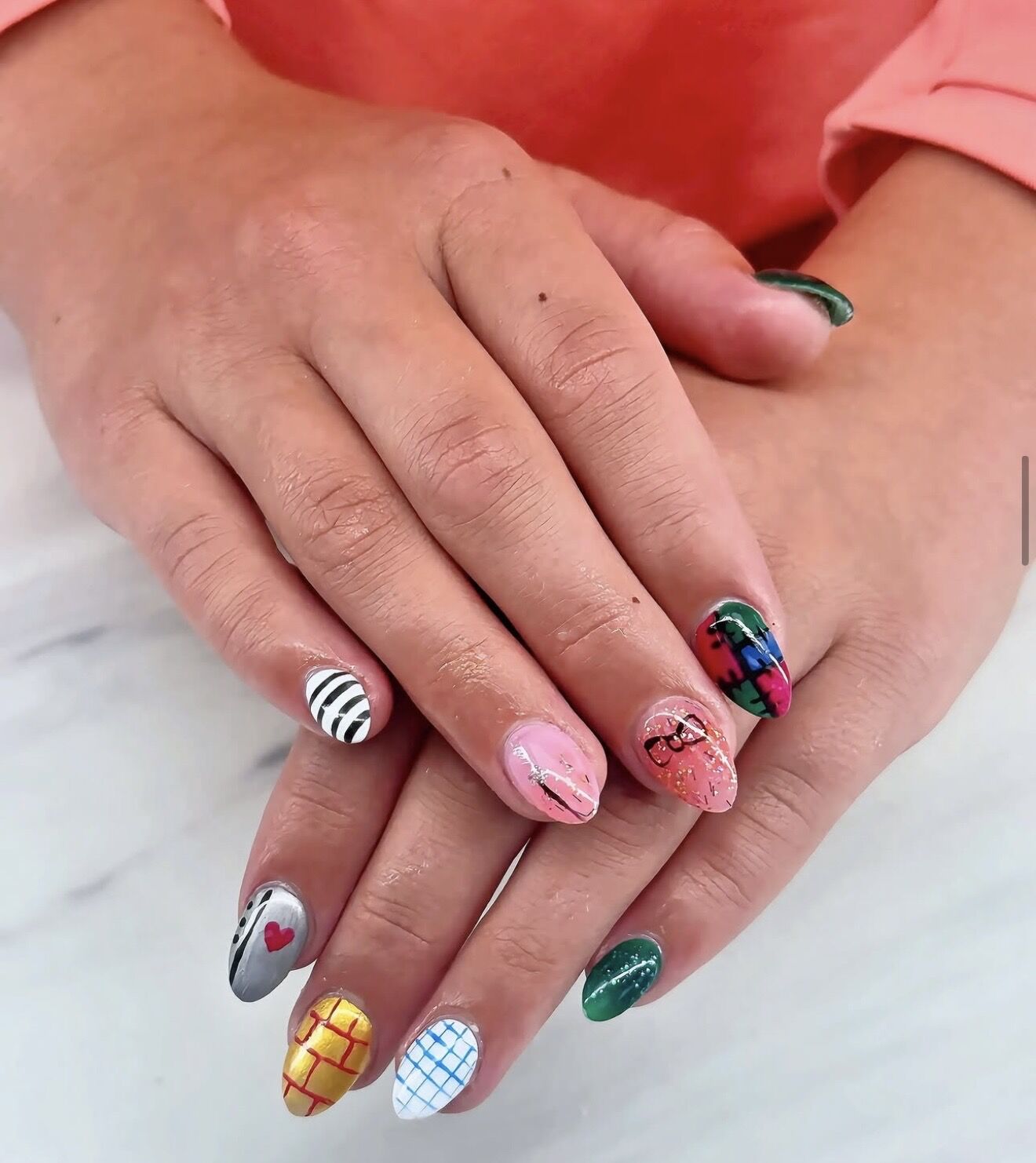 Playful mixed nail art with plaid, stripes, heart and gingham designs on gel nails, Lone Tree CO
